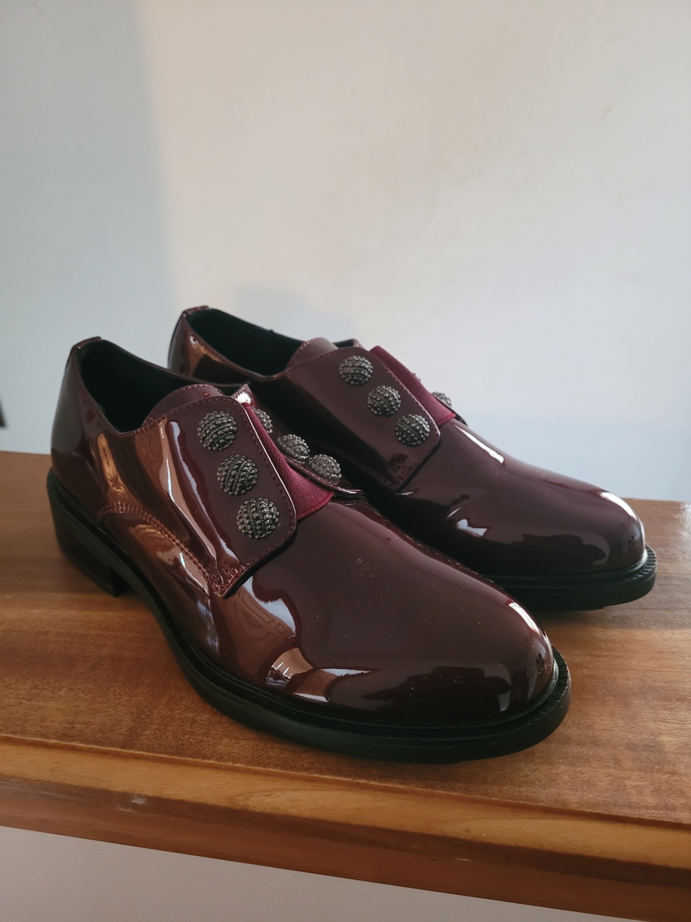 Patent Burgundy Slip-On Loafers with Decorative Button Accent